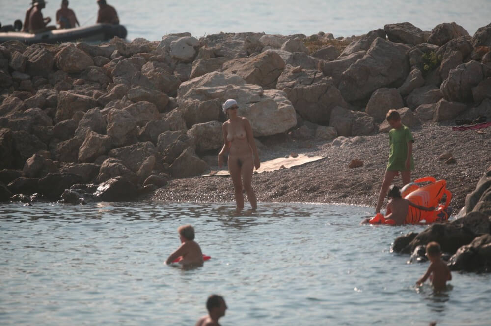 FKK cove pyramid in waters - A naked persons soul is visible through their body