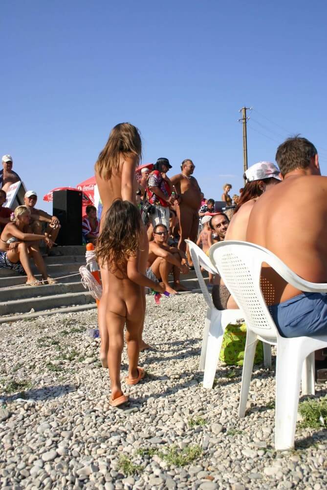 Naturist Standing Sideline - Many consider a free body and nudism to be central to their lives