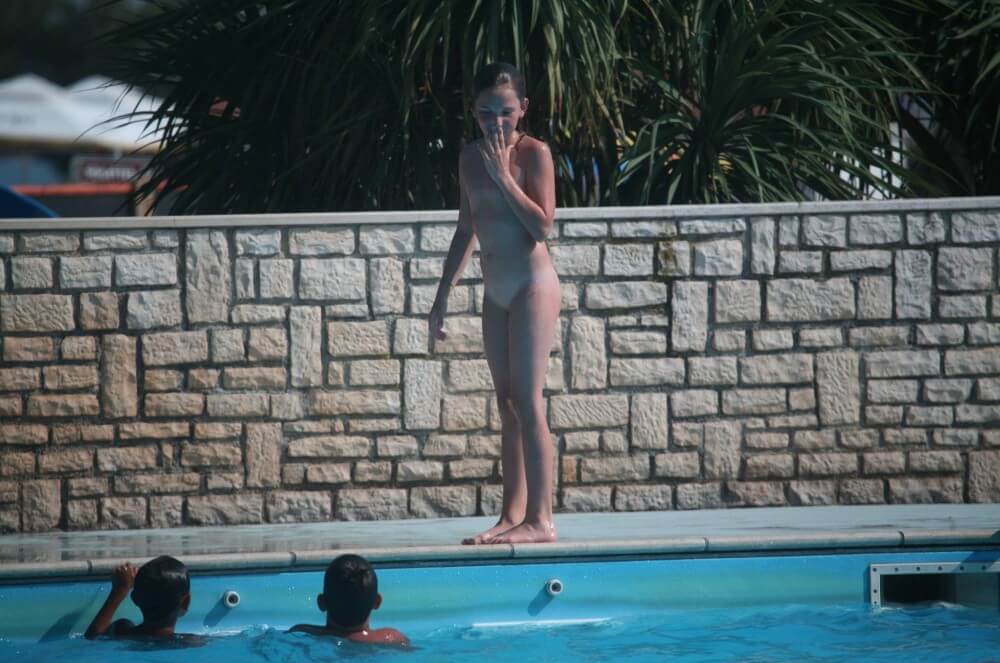 Naturist Pool-Side Singles photos - The practice of nudism fosters trust and honesty