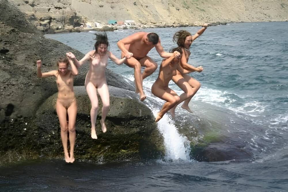 Mens and girls nudists on a beach - Unrestricted freedom as the core value of nudism