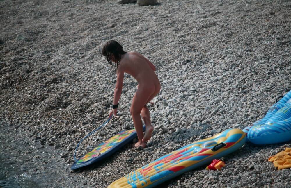 Naturist Surf Board Glides pics - People practice nudism to achieve harmony with nature