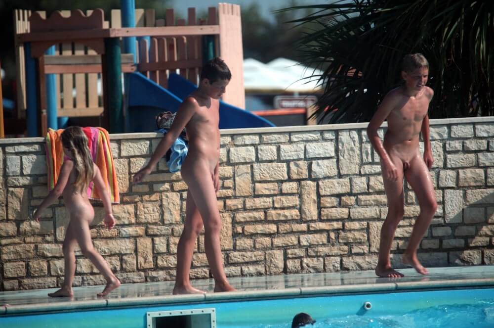 Naturist Pool Assortment photos - Melting under the scorching sun, I sunbathe naked