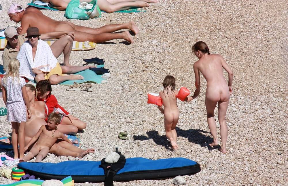 Orange Floaty Safety First Naturist pics - Naturism teaches respect and love for the natural world