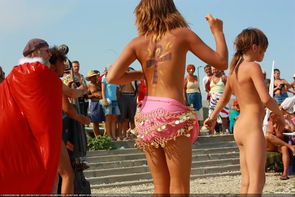 Colorful Carnival Dancing photos - A nudist values simplicity in life and naturalness in expression